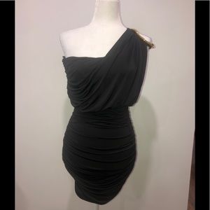 Black cocktail dress with gold detail